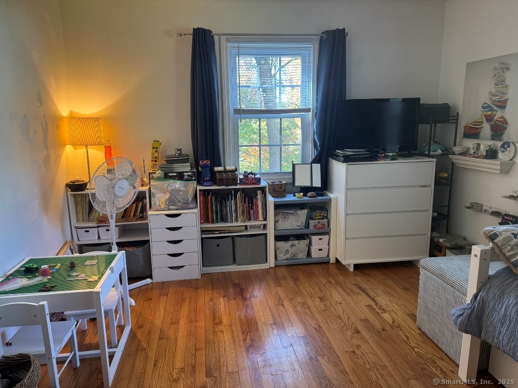 1166 Spindle Hill Road Wolcott, CT 06716 - Photo 13 of 29 a living room with furniture and a flat screen tv