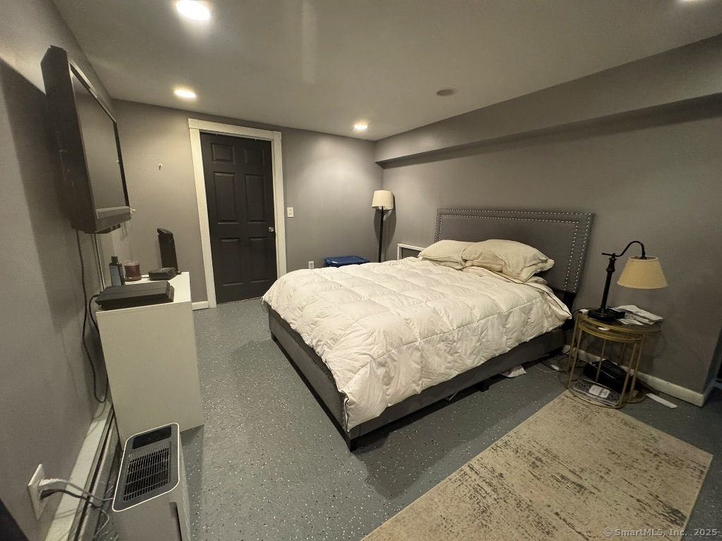 1166 Spindle Hill Road Wolcott, CT 06716 - Photo 17 of 29 a bedroom with a bed garage and a chair