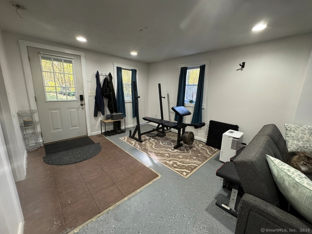 1166 Spindle Hill Road Wolcott, CT 06716 - Photo 20 of 29 a view of a livingroom with workspace and a window