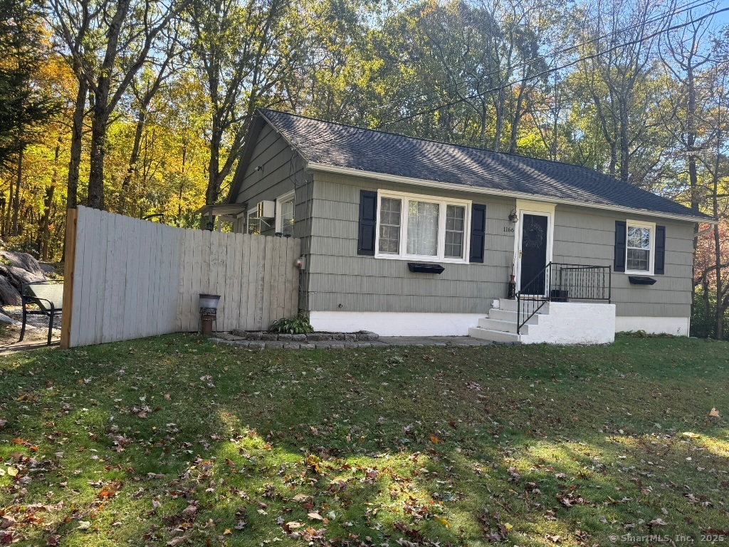 1166 Spindle Hill Road Wolcott, CT 06716 - Photo 28 of 29 a front view of house with yard and green space