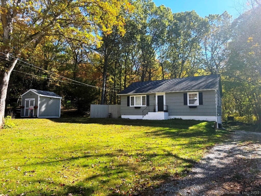 1166 Spindle Hill Road Wolcott, CT 06716 - Photo 29 of 29 a front view of a house with yard and swimming pool