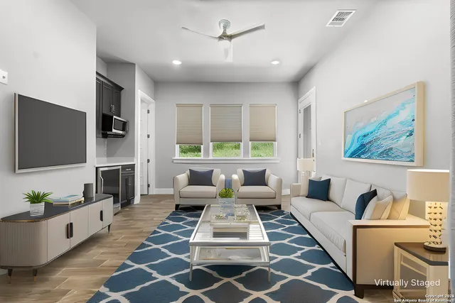 an empty room with windows and a fireplace