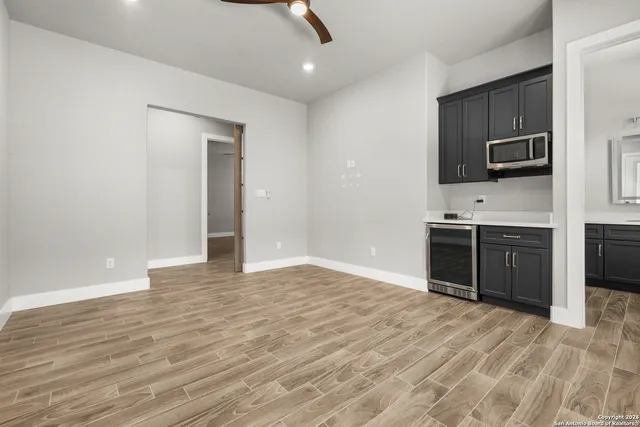 a bedroom with a bed and a potted plant