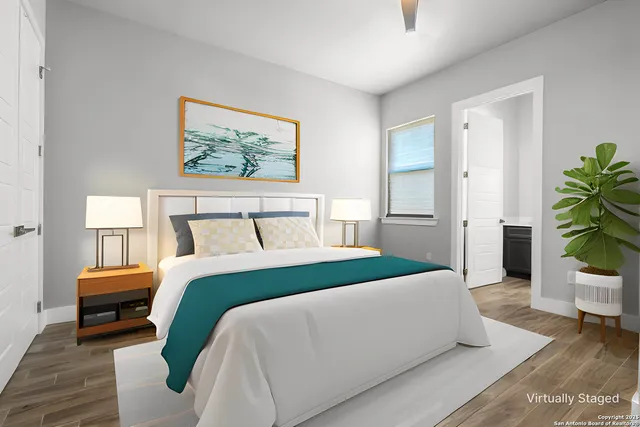 a view of an empty room with wooden floor and closet