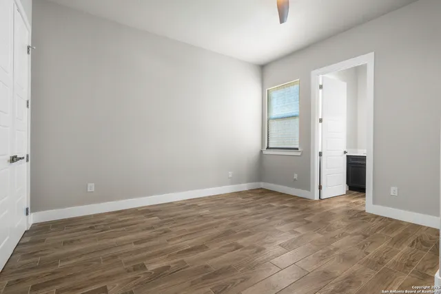 a bathroom with a bathtub a sink a vanity and a toilet