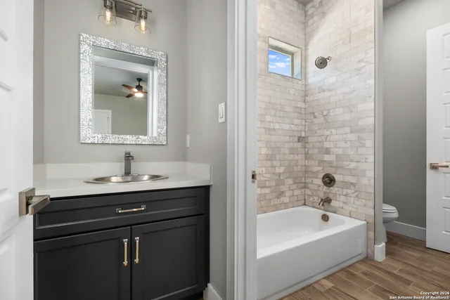 a bedroom with furniture and large window