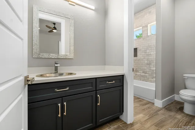 a view of a workspace with a bookshelf