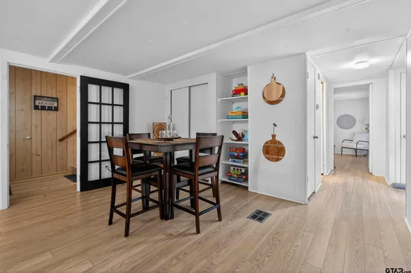 a kitchen with stainless steel appliances a sink and a microwave