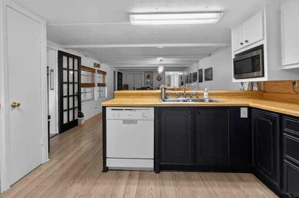 a bathroom with a shower curtain and a sink