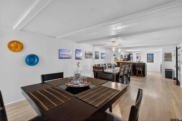 a bedroom with a bed and a potted plant