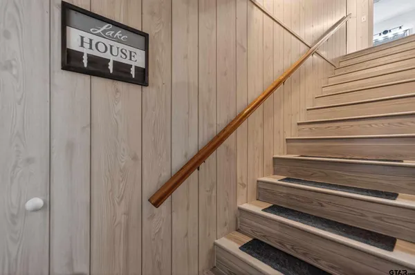 a spacious bedroom with a bed and window