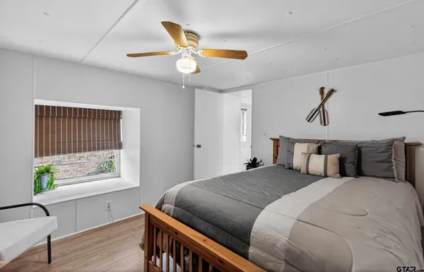 a view of a house with a yard and a patio