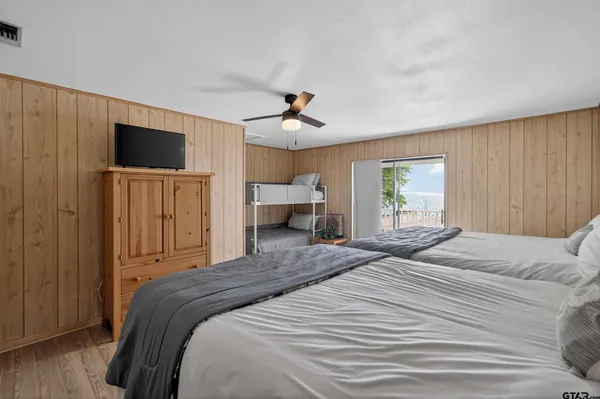 a front view of a house with a garden and yard