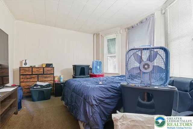 a bed room with a bed and furniture