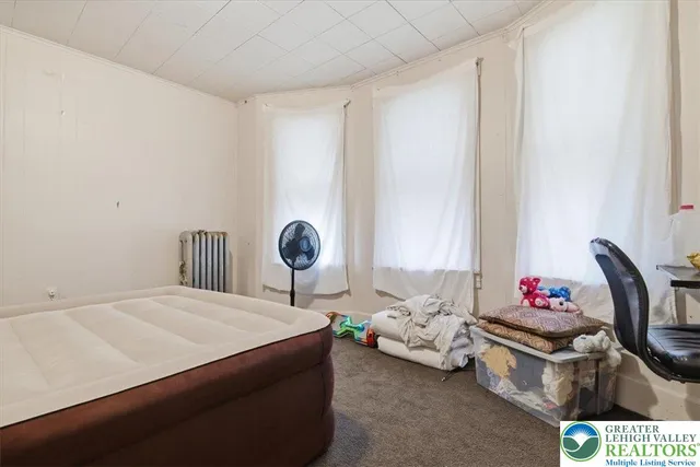 a view of a hall with wooden floor