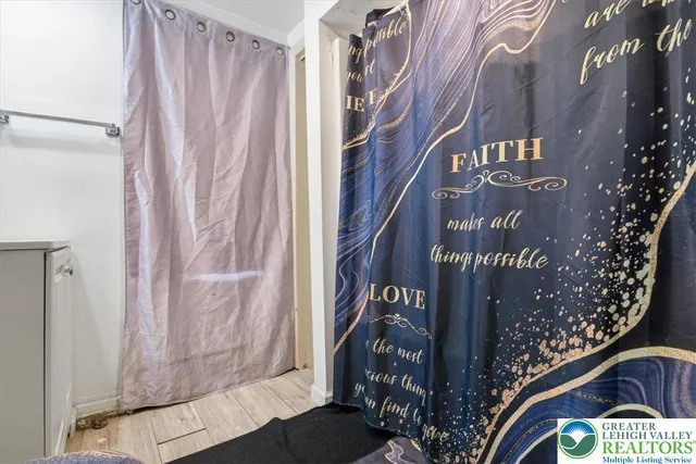 a view of a chairs and table in backyard of the house