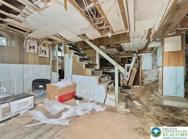 a backyard of a house with barbeque oven table and chairs
