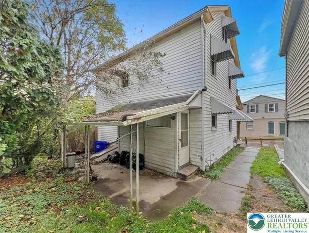an aerial view of residential house with outdoor space