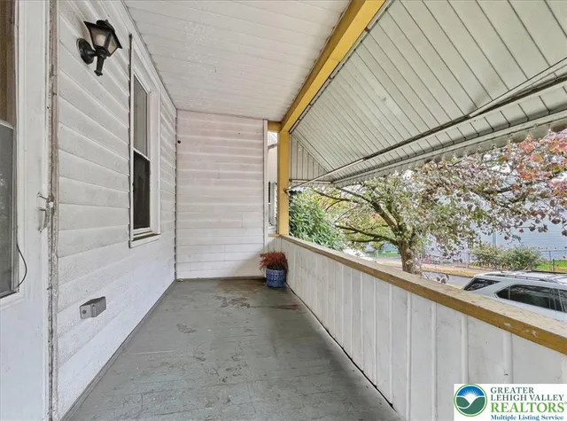 a view of a balcony with window