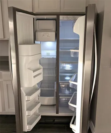 a stove top oven sitting inside of a kitchen