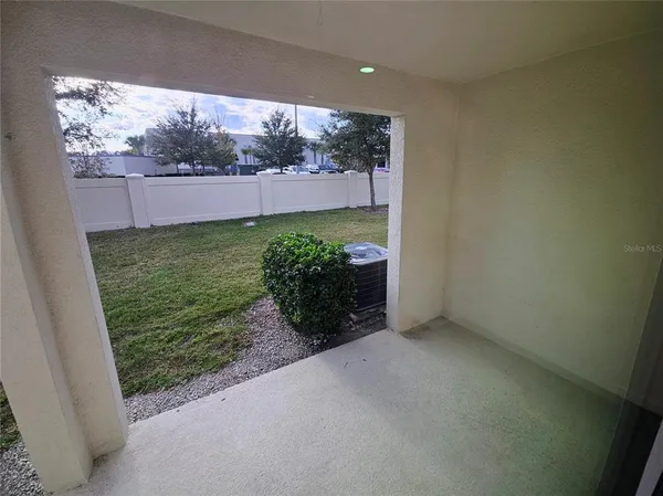 a view of a house with wooden fence