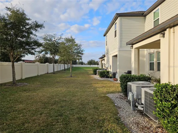 a house view with swimming pool in front of it