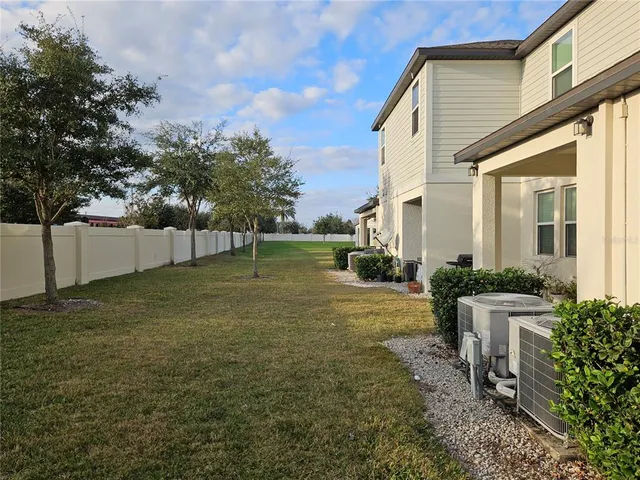 a house view with swimming pool in front of it