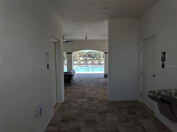 a view of a swimming pool with outdoor seating
