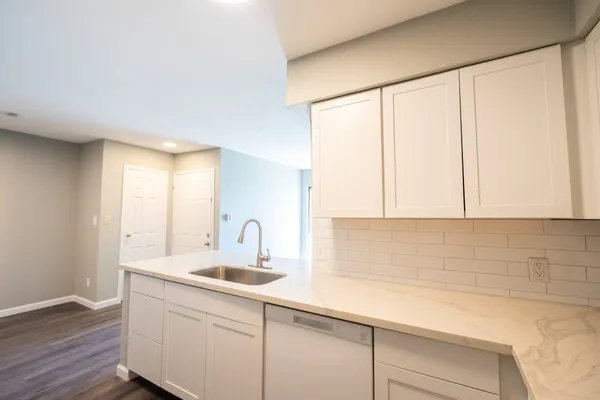 a kitchen with a sink and cabinets