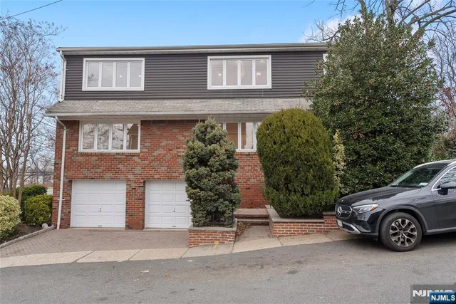 front view of a house with a garden