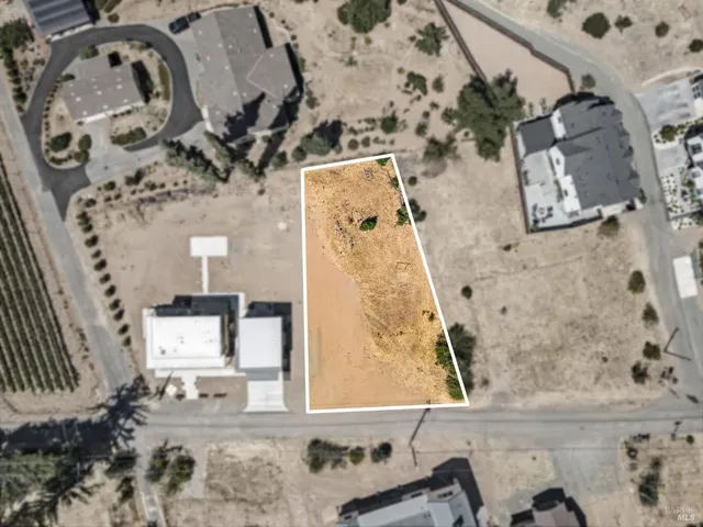 an aerial view of a house with a outdoor space