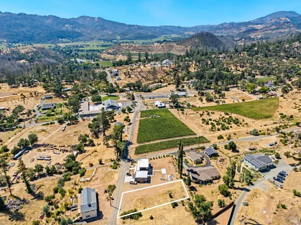 an aerial view of residential house with an outdoor space
