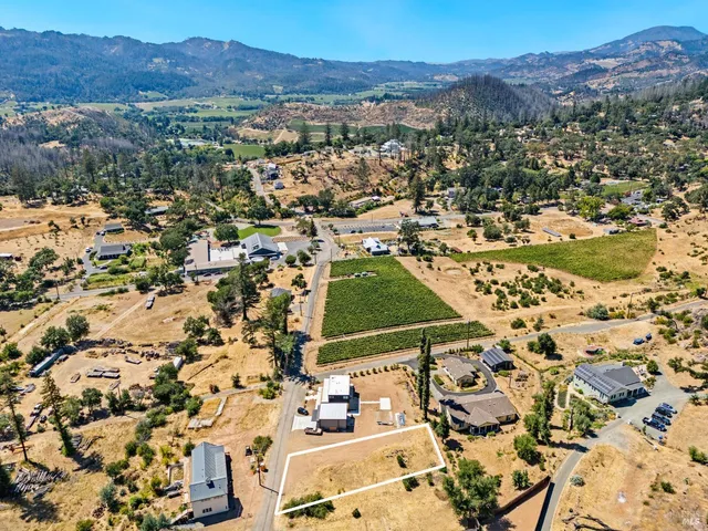an aerial view of residential house with an outdoor space