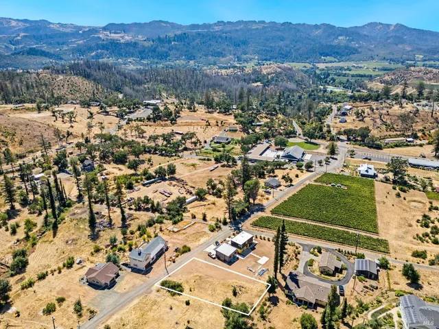 an aerial view of residential house and sandy dunes