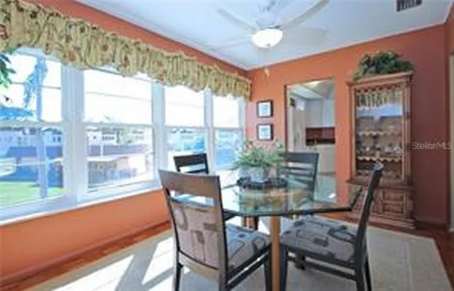 a view of a dining room with furniture window and outside view