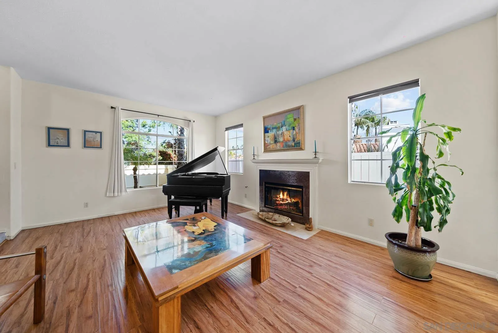 308 Crestview Drive Bonita, CA 91902 - Photo 14 of 37 a living room with furniture a potted plant and a fireplace