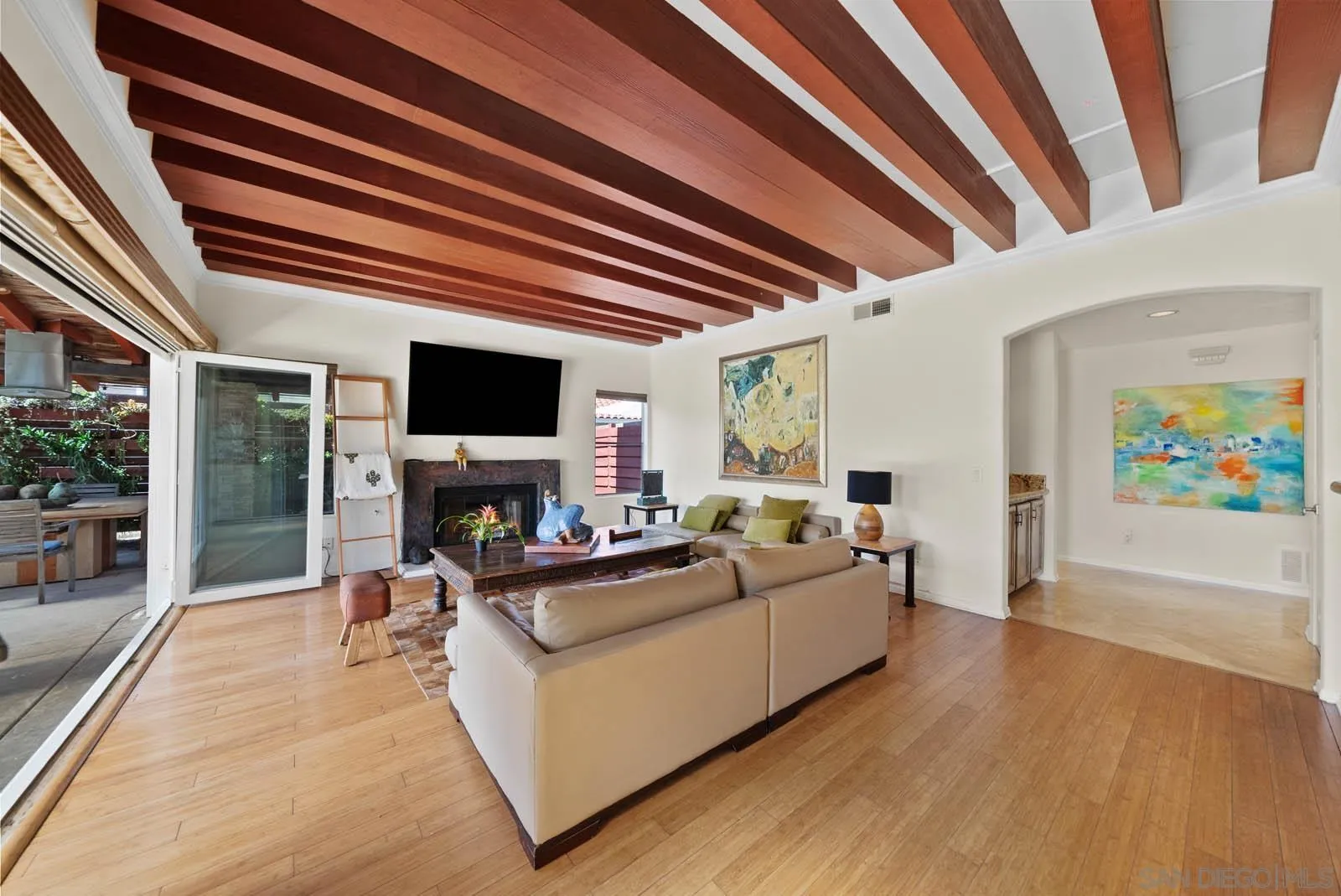 308 Crestview Drive Bonita, CA 91902 - Photo 21 of 37 a living room with furniture a fireplace and a flat screen tv