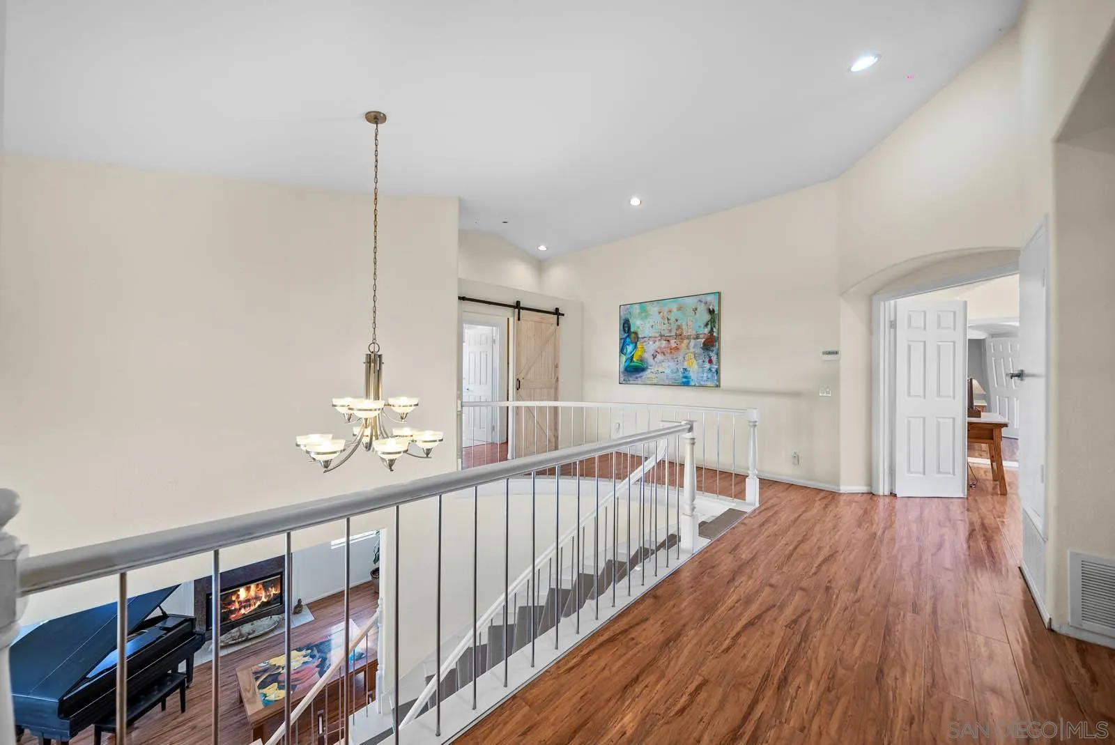 308 Crestview Drive Bonita, CA 91902 - Photo 26 of 37 a view of a hallway with wooden floor and stairs