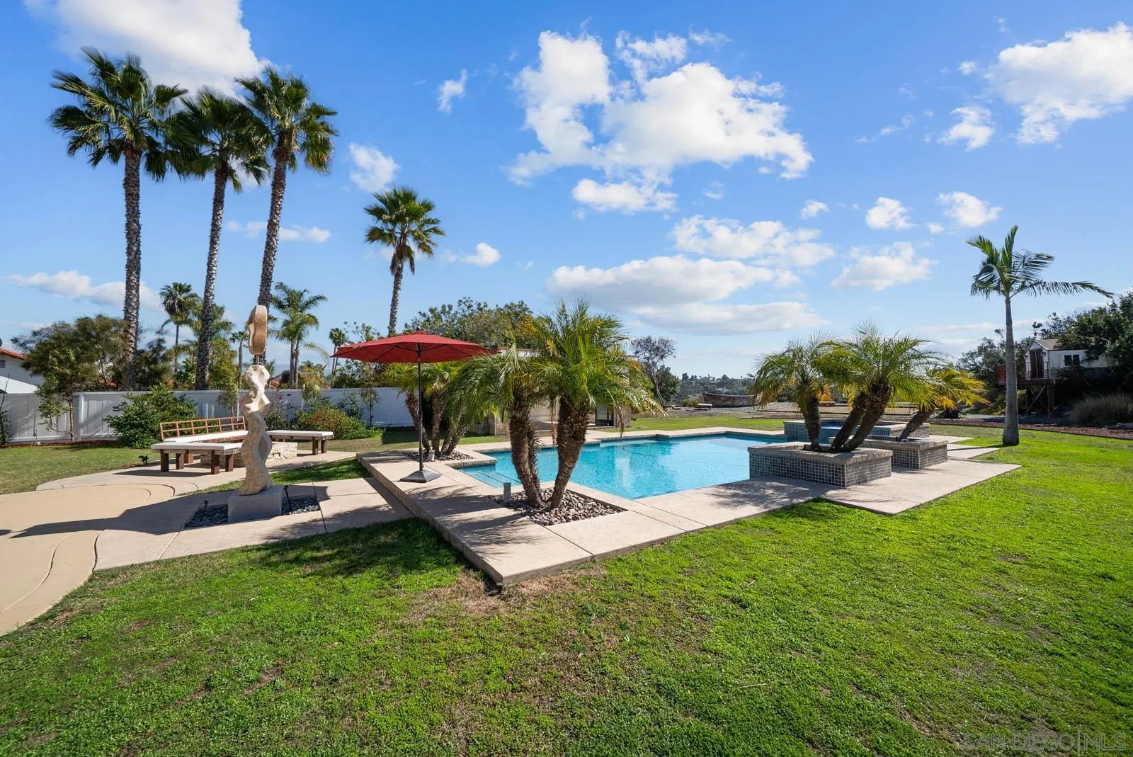 308 Crestview Drive Bonita, CA 91902 - Photo 27 of 37 a view of a swimming pool with a table and chairs