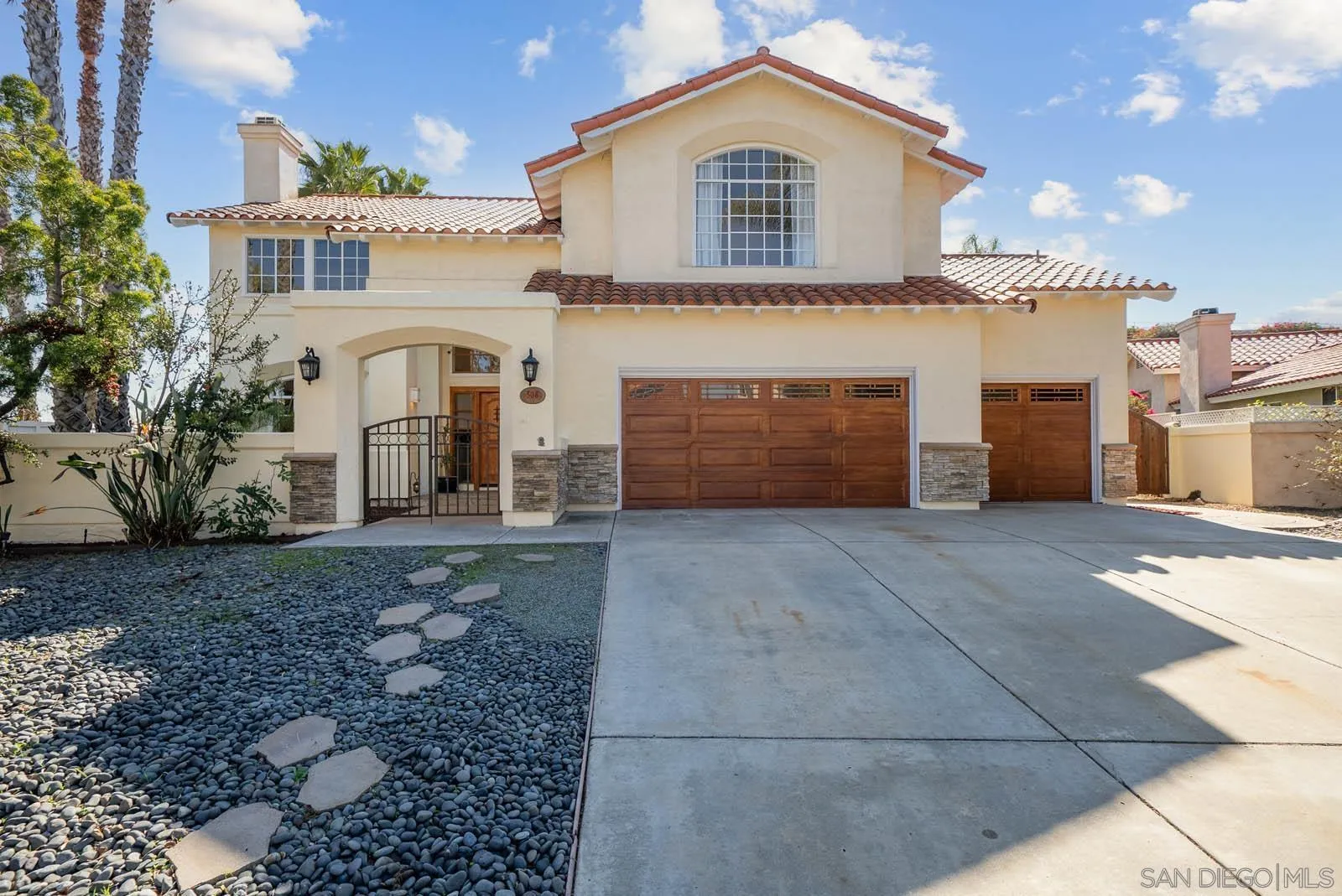 308 Crestview Drive Bonita, CA 91902 - Photo 6 of 37 a view of a grey house with a yard and garage