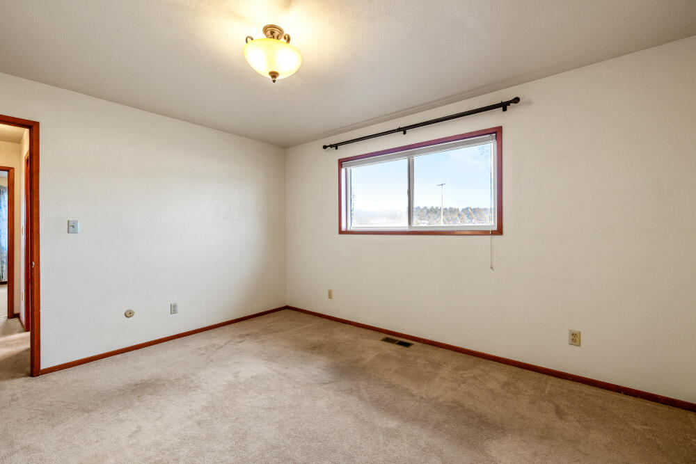 23131 North Poe Valley Road Klamath Falls, OR 97603 - Photo 22 of 45 an empty room with a window