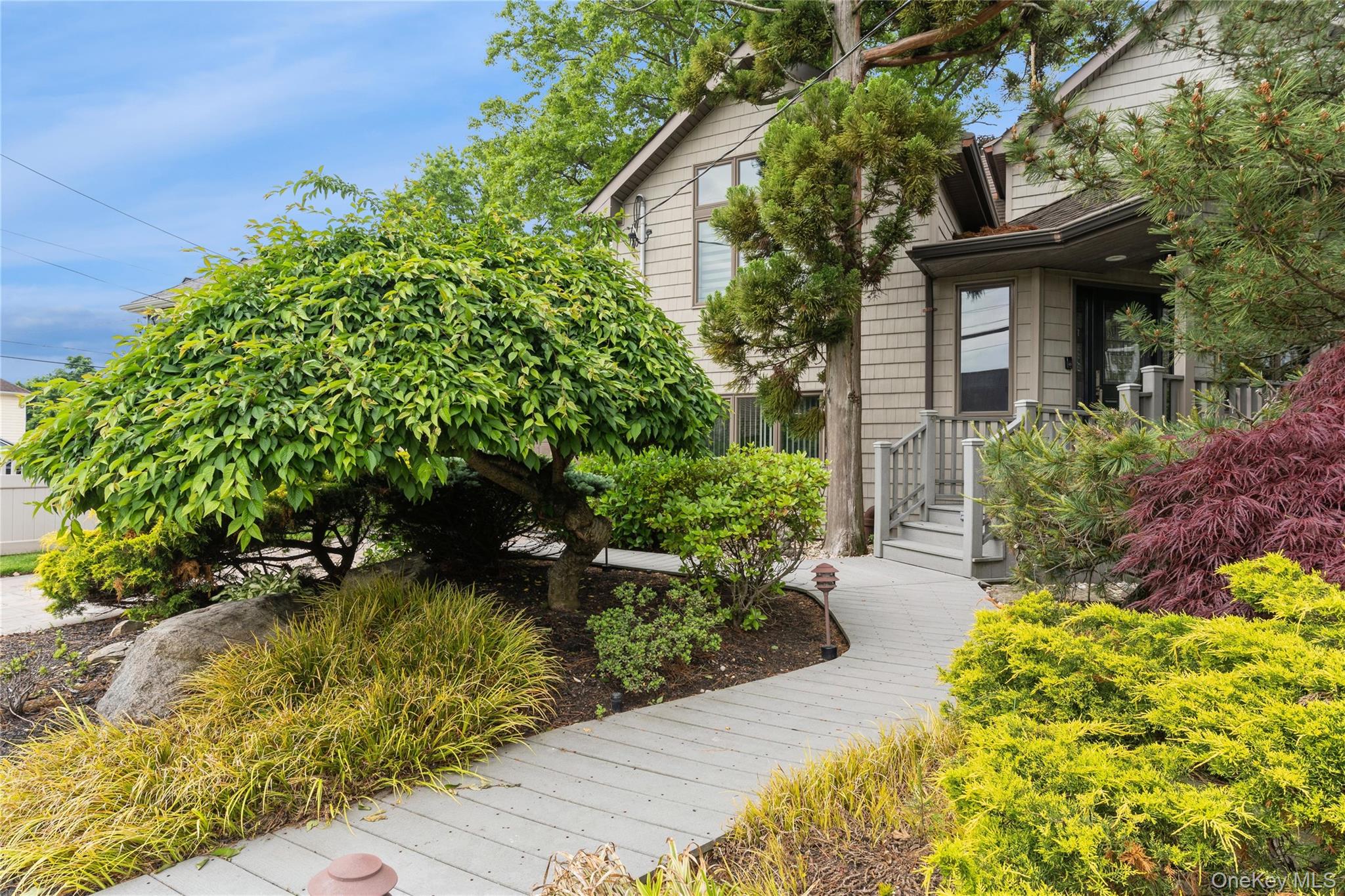 2772 Riverside Avenue Merrick, NY 11566 - Photo 44 of 45 a front view of a house with a yard
