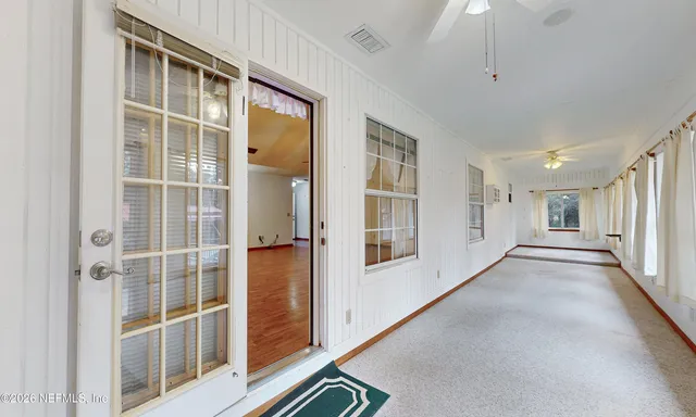 a view of an empty room with a window