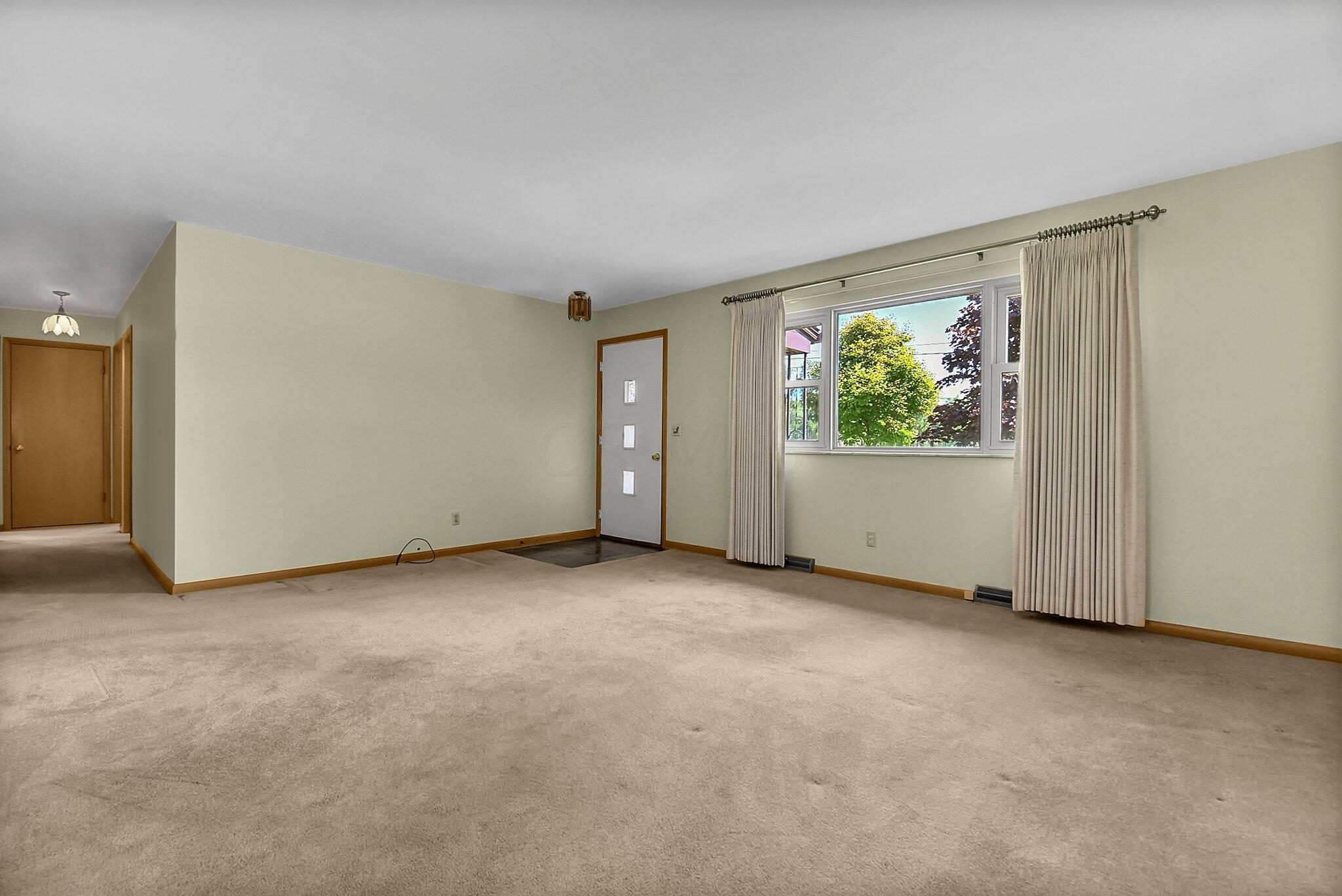 429 Amity Road Galloway, OH 43119 - Photo 5 of 27 Full view front window. Windows tilt in for ease of cleaning, top sash glides down. For security w/stops to open for breeze.
