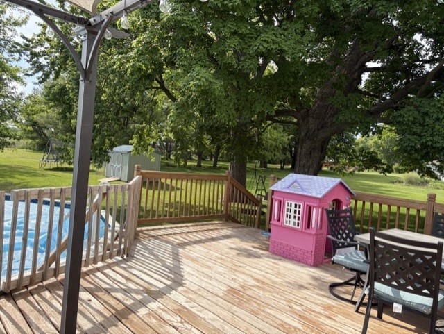 4373 East 250th Road Mendota, IL 61342 - Photo 24 of 26 a view of a wooden deck with a bench