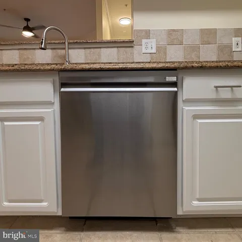 a close view of kitchen countertops with granite countertop