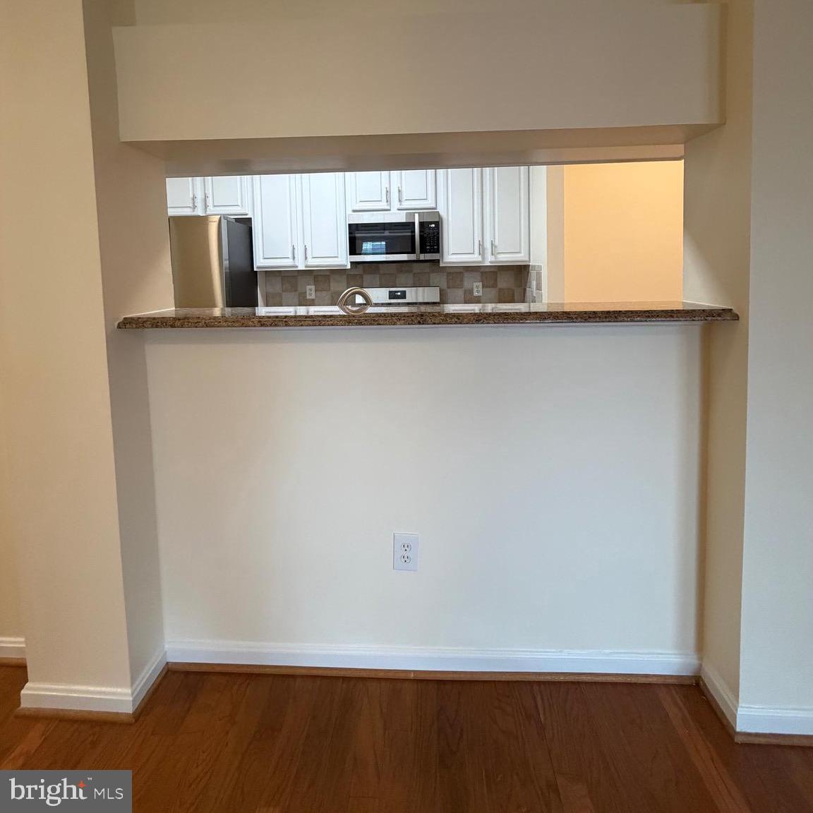 20453 Chesapeake Square, Unit 101 Sterling, VA 20165 - Photo 21 of 51 View from hall to kitchen