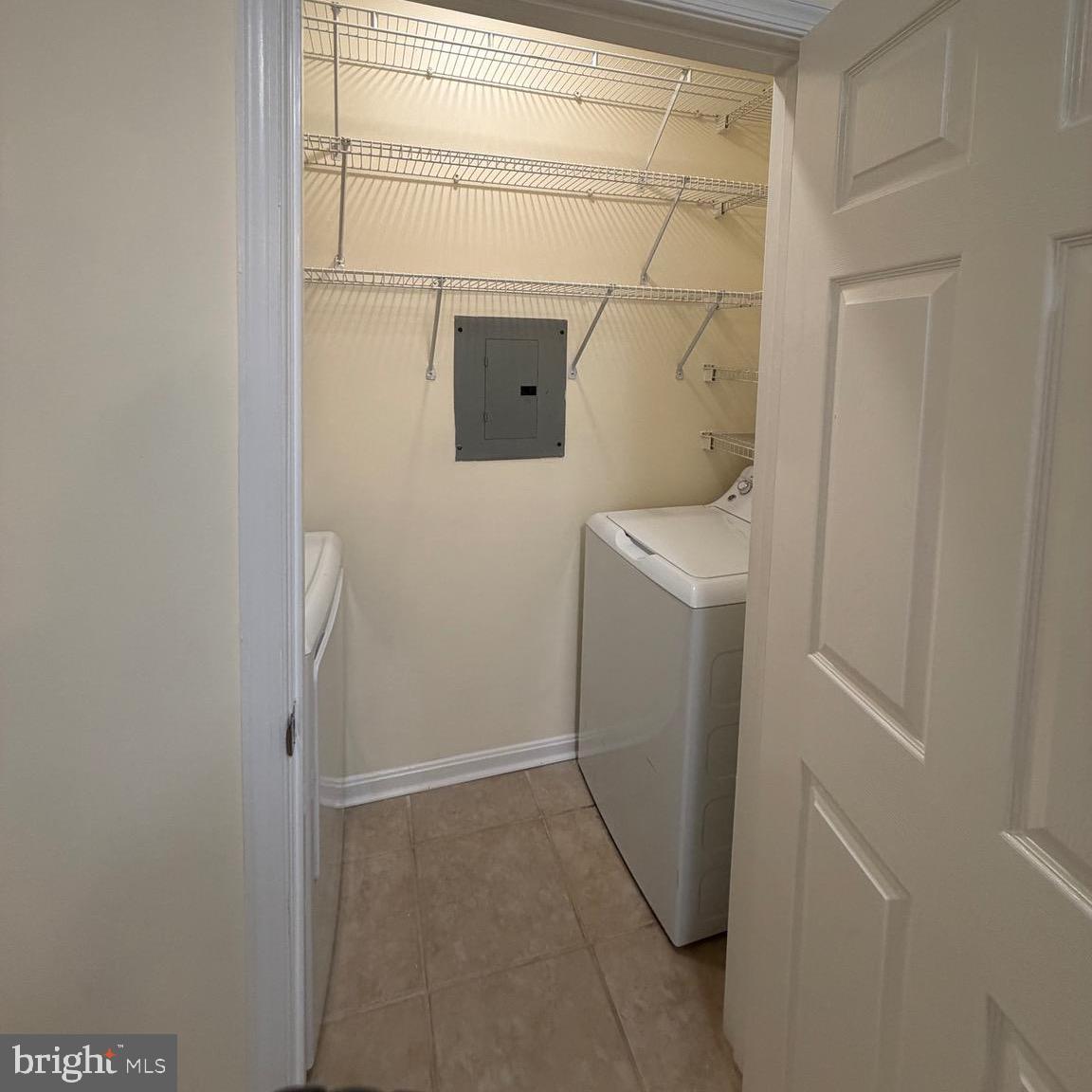 20453 Chesapeake Square, Unit 101 Sterling, VA 20165 - Photo 46 of 51 Laundry room with lots of shelving