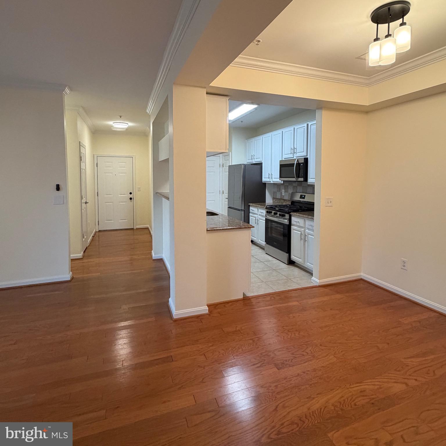 20453 Chesapeake Square, Unit 101 Sterling, VA 20165 - Photo 6 of 51 View from dining room to kitchen