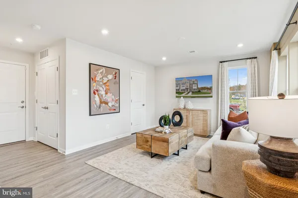 a living room with furniture and a table